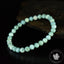 Bracelet Larimar perles 6mm rondes facettées AA