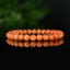 Bracelet Calcite Orange vif perles 6mm qualité AA - inclusions de mica noir
