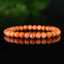 Bracelet Calcite Orange vif perles 6mm qualité AA - inclusions de mica noir