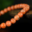 Bracelet Calcite Orange vif perles 6mm qualité AA - inclusions de mica noir