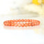 Bracelet Calcite Orange vif perles 6mm qualité AA - inclusions de mica noir