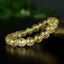 Bracelet Quartz Rutile doré 10mm perles rondes AAA