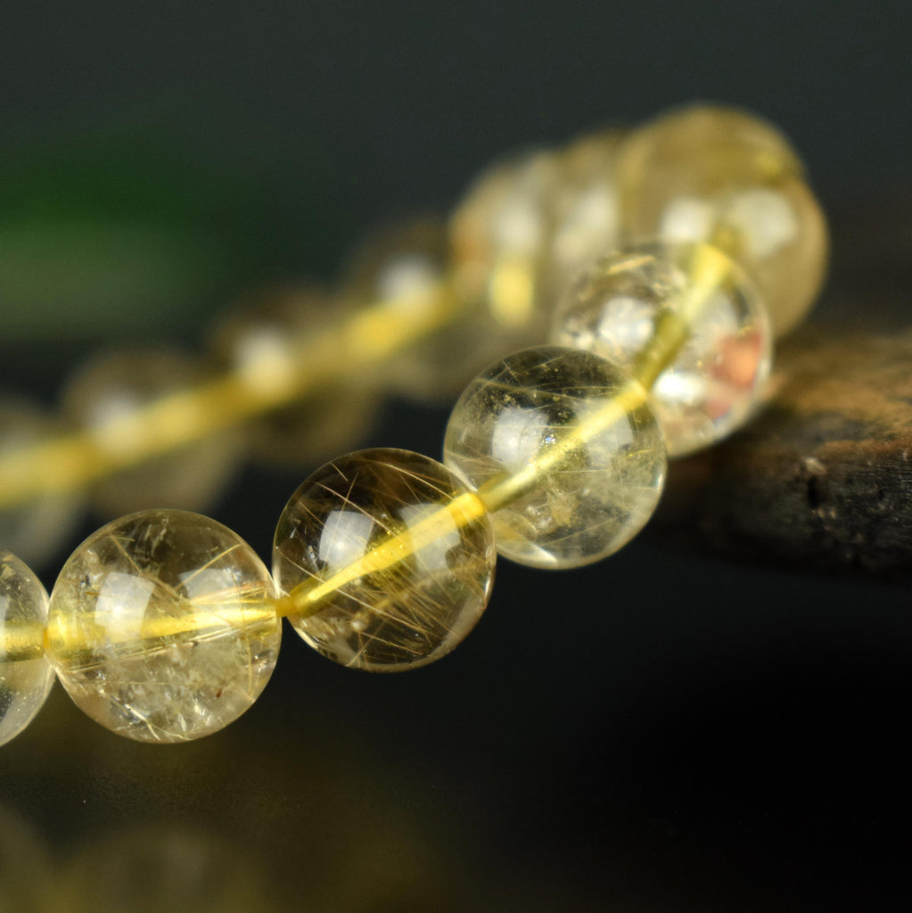 Bracelet Quartz Rutile doré 10mm perles rondes AAA
