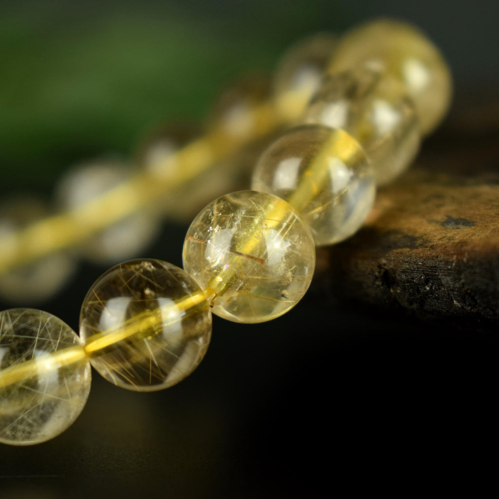 Bracelet Quartz Rutile doré 10mm perles rondes AAA