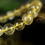 Bracelet Quartz Rutile doré 10mm perles rondes AAA