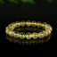 Bracelet Quartz Rutile doré 10mm perles rondes AAA